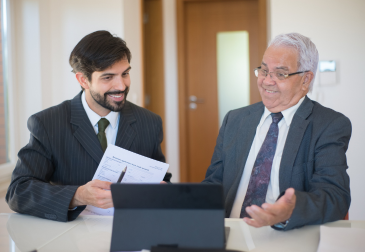 Corporate consultant reviewing certificate attestation and legalization documents in UAE office