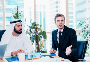 Entrepreneurs discussing business registration and licensing opportunities in Dubai