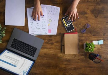 Financial consultant reviewing business reports and financial planning documents