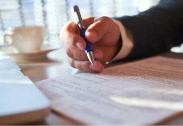 Professional legal translator reviewing official documents in Dubai office